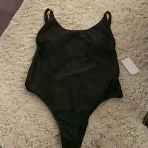 Black 1 piece scoop neck low back swimsuit. Sits high on the hip. Size XL NWT